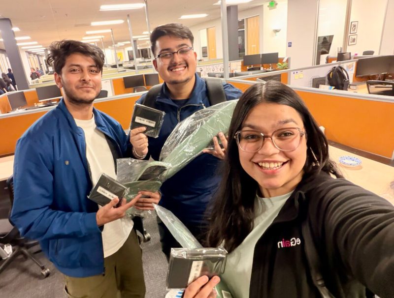 Team OPTimize celebrating their eGain hackathon wins