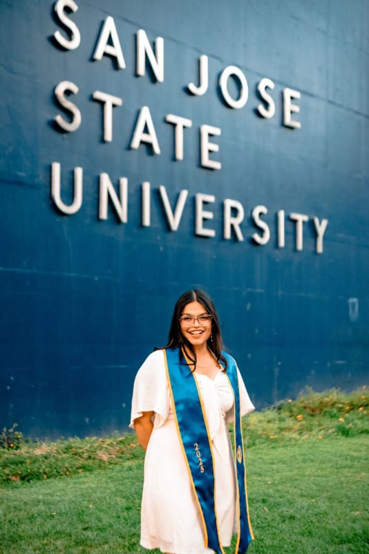 Khushi in her 2025 graduation stole at San José State University
